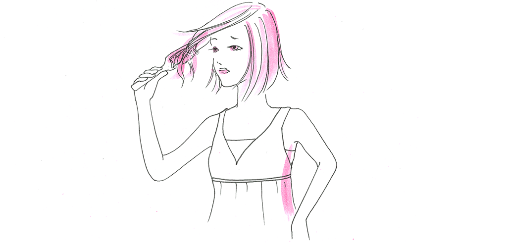 髪を触る女性