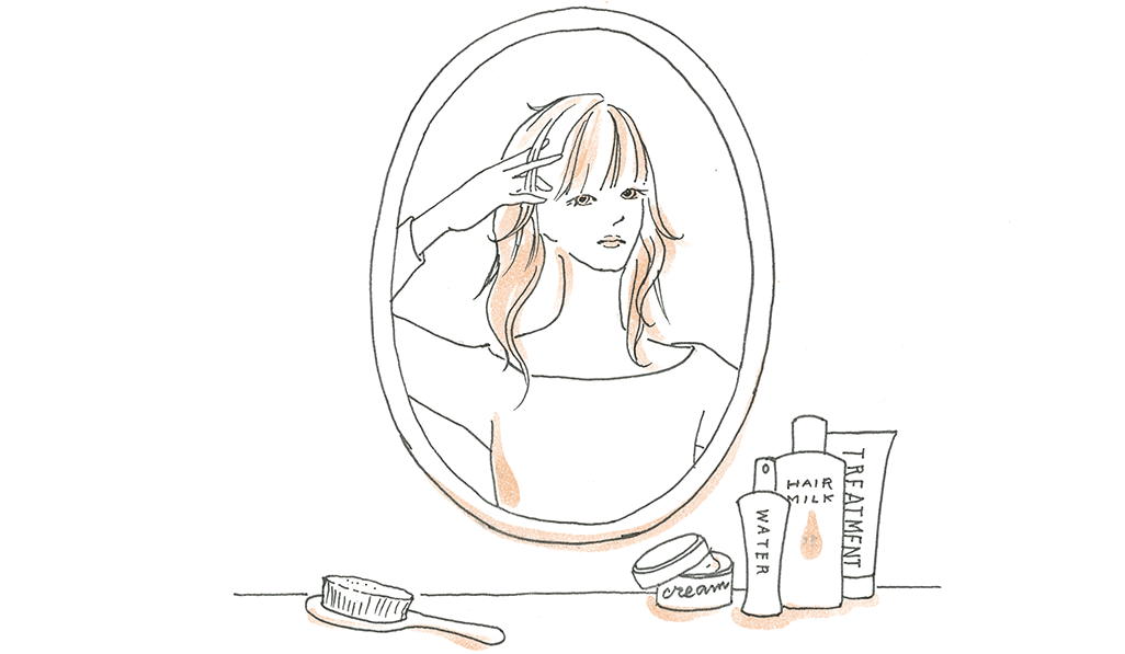 鏡に映る女性